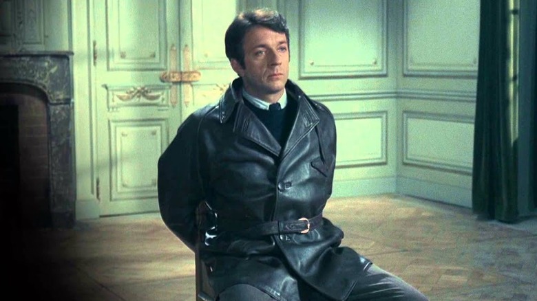 Jean-François Jardie tied to a chair in 