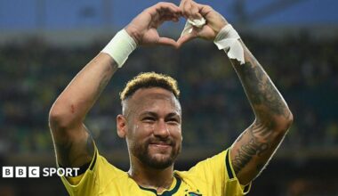 Neymar makes the heart sign with his hands while he celebrates Brazil's win over Scotland in Miami