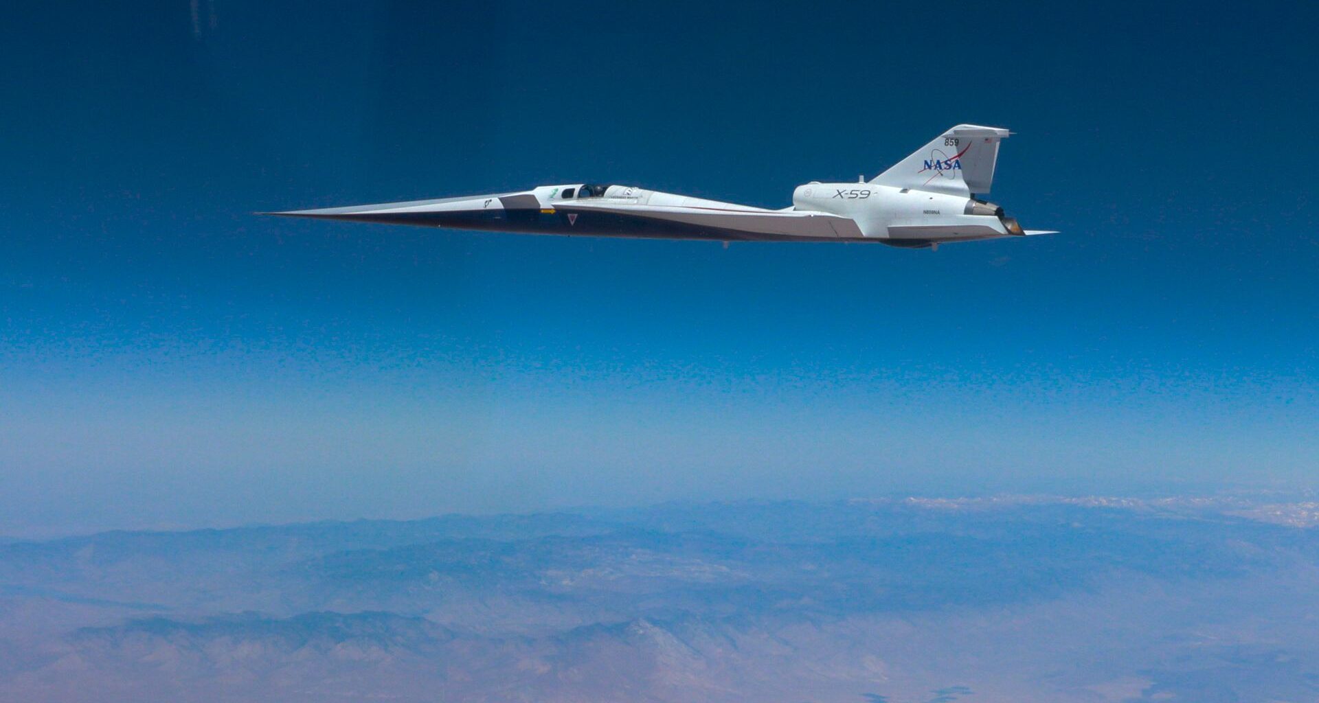 A sleek plane floats in the sky