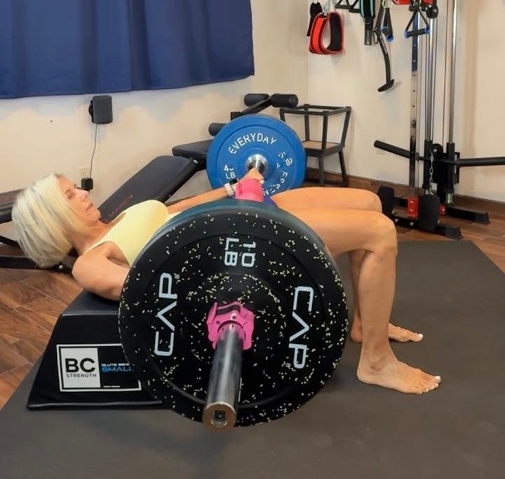 Weightlifting session with a barbell and weights.