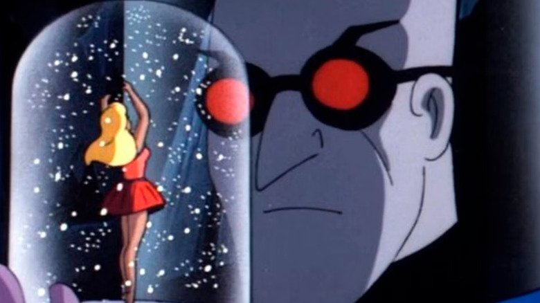 Mr. Freeze (Michael Ansara) examines a snowglobe in Batman: The Animated Series