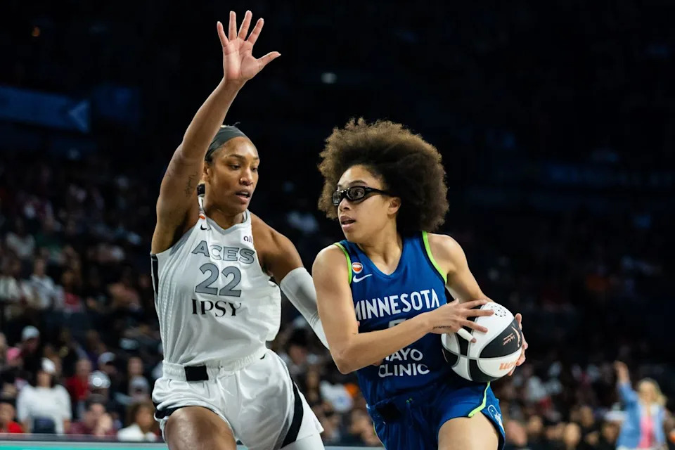 Minnesota Lynx guard Olivia Miles (5) drives to the basket as Las Vegas Aces forward A’ja Wilson (22) defends her during a WNBA game between the Las Vegas Aces and the Minnesota Lynx, Saturday June 13, 2026 in Las Vegas, Nev.