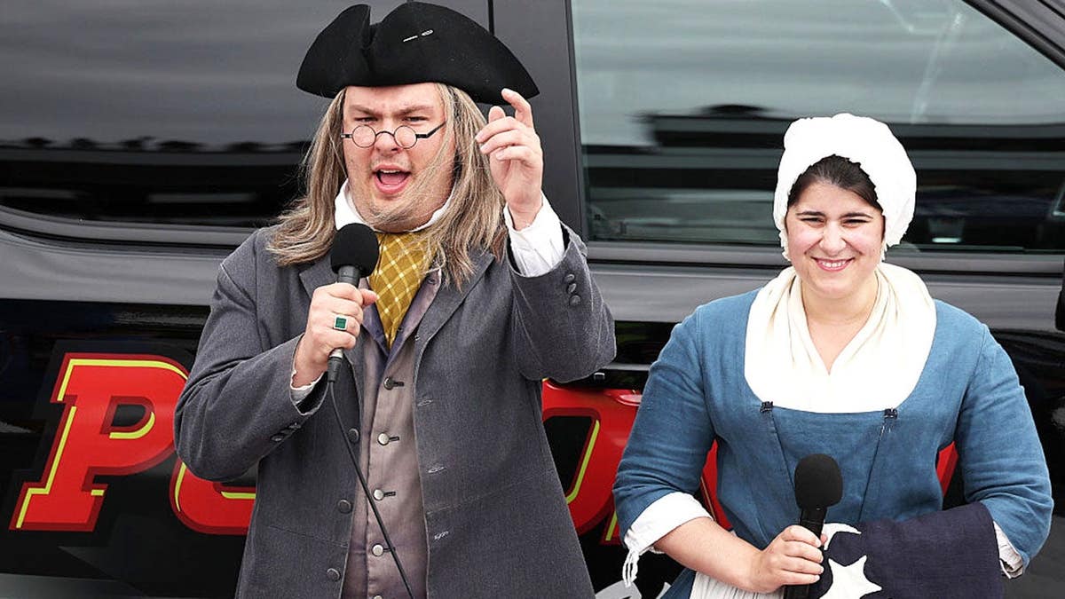 Actors dressed as Benjamin Franklin and Betsy Ross giving start engine command at Pocono Raceway