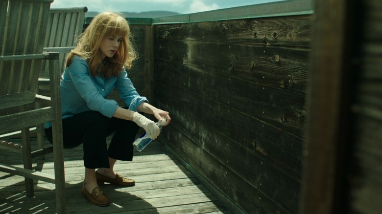 Celeste sitting in the porch and looking at the floor on Big Little Lies S1E7