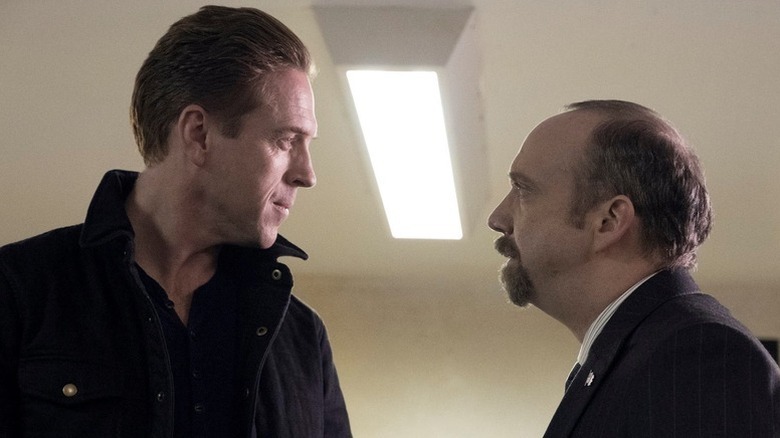 Bobby Axelrod (Damian Lewis) and Chuck Rhoades (Paul Giamatti) face each other tensely in Billions