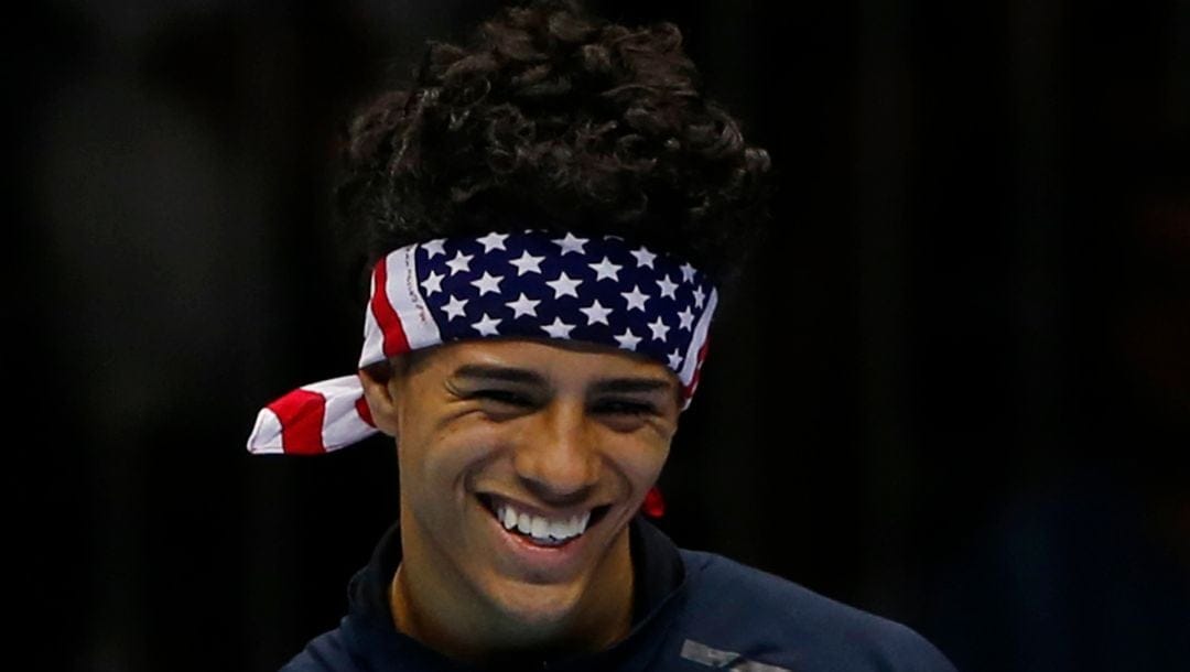 Antonio Vargas of the U.S. holds up one finger as he steps on to the podium to receive the gold medal for men’s flyweight boxing.