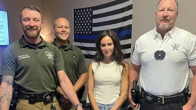 Samantha Busch poses with Lincoln County first responders during a visit to thank them for assisting her family.
