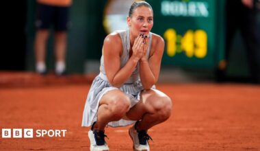 Marta Kostyuk crouches down with her hands on her face after completing victory over Elina Svitolina