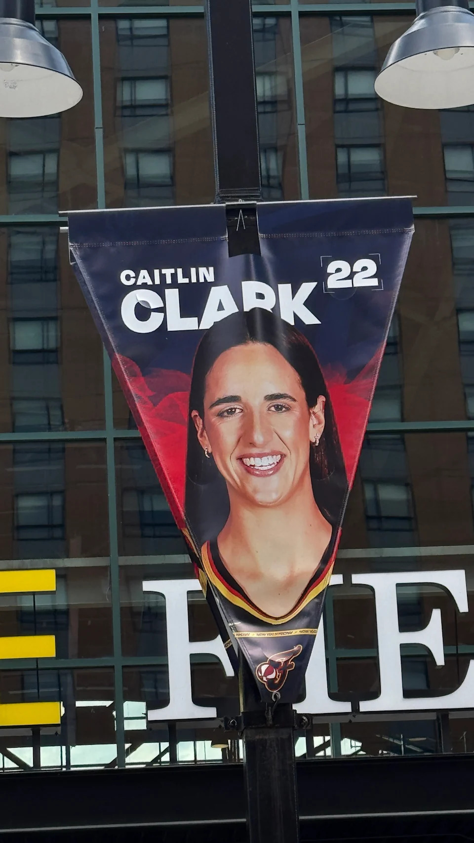 Caitlin Clark's Indiana Fever banner on a light fixture in downtown Indianapolis