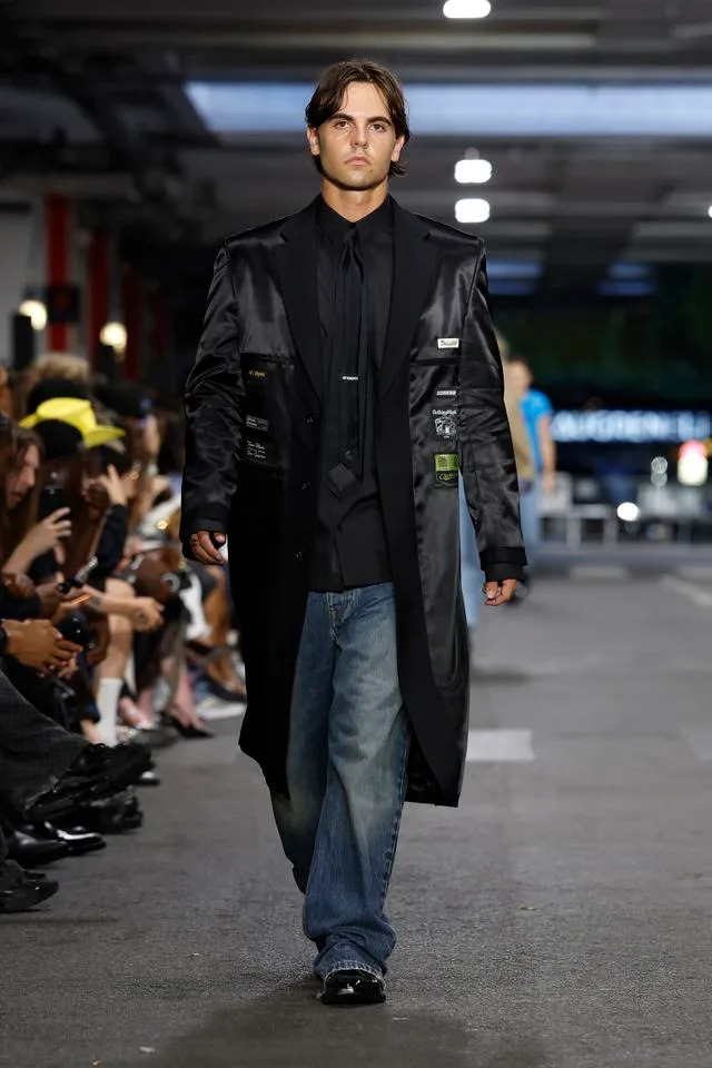 Sean Preston wore a long satin coat and jeans.Credit: Getty