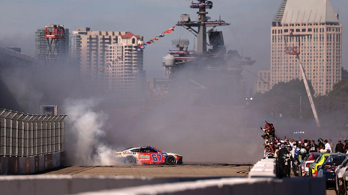 Corey Heim celebrating with a burnout after winning NASCAR Cup Series race in San Diego
