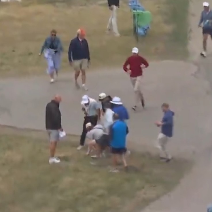 A fan picks up Rory McIlroy's ball after a shot on the fourth hole during the first round of the U.S. Open on June 18, 2026.