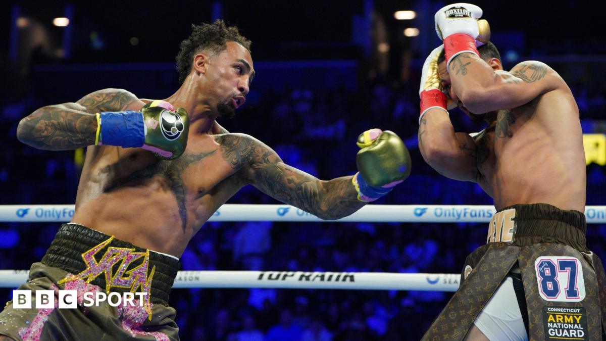 Great Britain's Ben Whittaker punches Richard Rivera during their light-heavyweight bout in Brooklyn