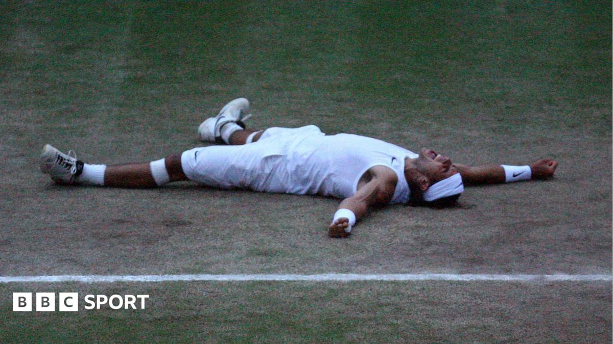 Rafael Nadal bites the Wimbledon trophy