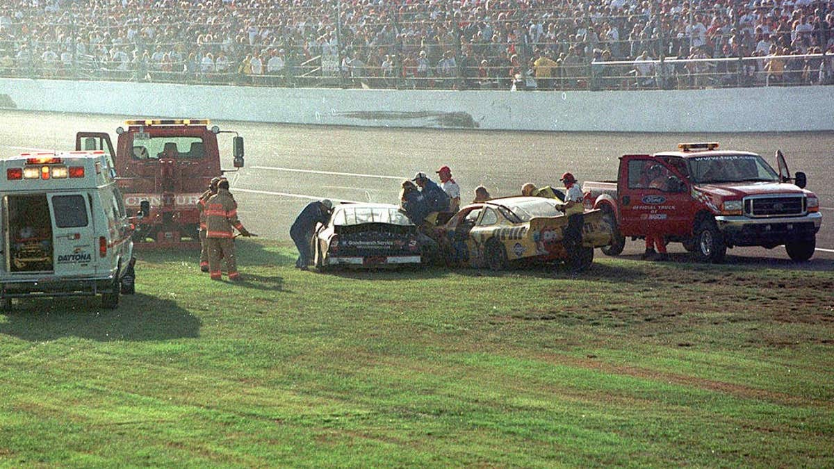 Rescue workers arriving at Dale Earnhardt's Goodwrench Chevrolet after a crash at Daytona International Speedway