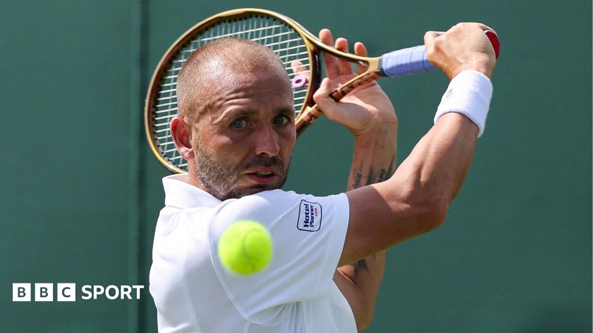Dan Evans hits a backhand