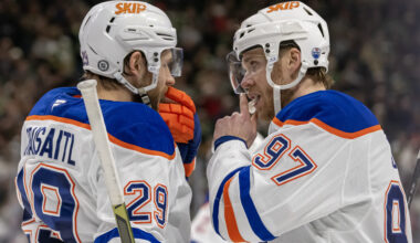 Edmonton Oilers forward Leon Draisaitl (29) and forward Connor McDavid (97) talk before a face-off