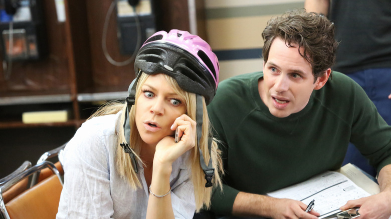 Dee and Dennis look intense while talking