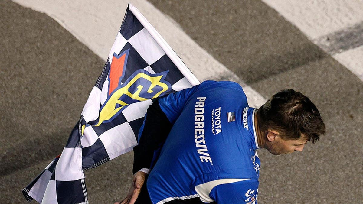 Denny Hamlin taking a bow on the race track at Nashville Superspeedway