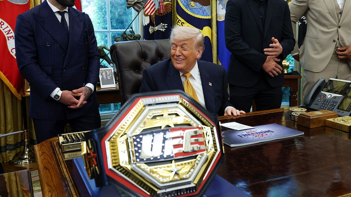 U.S. President Donald Trump standing with UFC fighters Ilia Topuria, Justin Gaethje, and Ciryl Gane in the Oval Office
