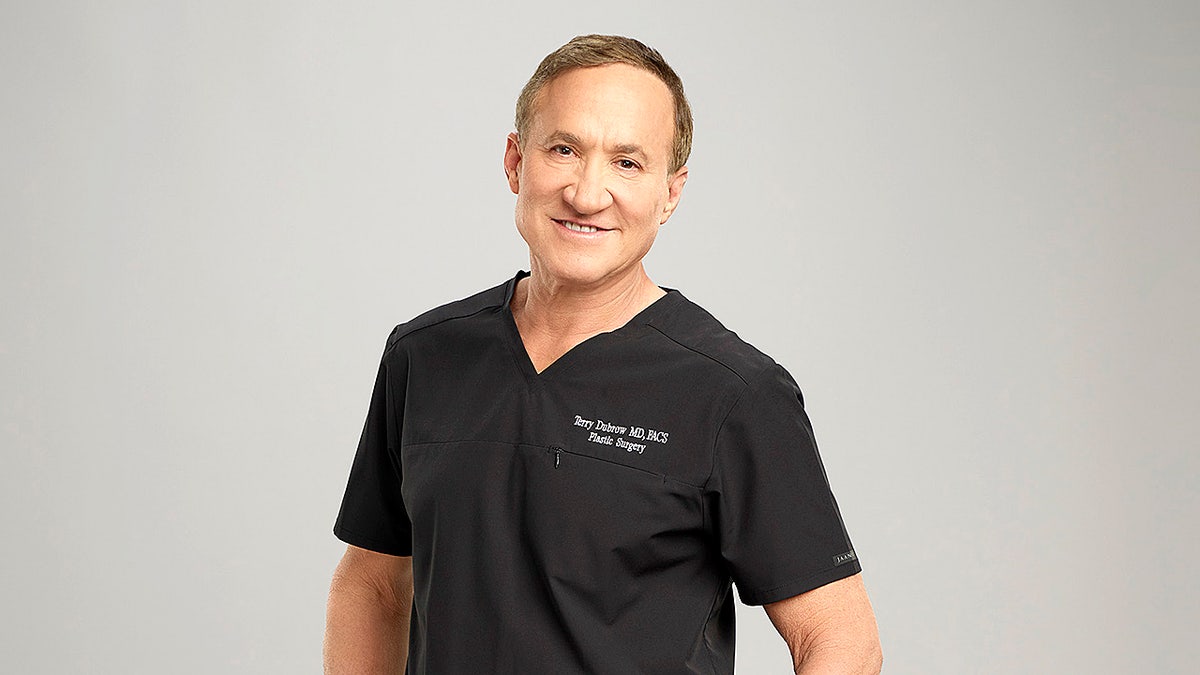 Dr. Terry Dubrow standing in a studio setting