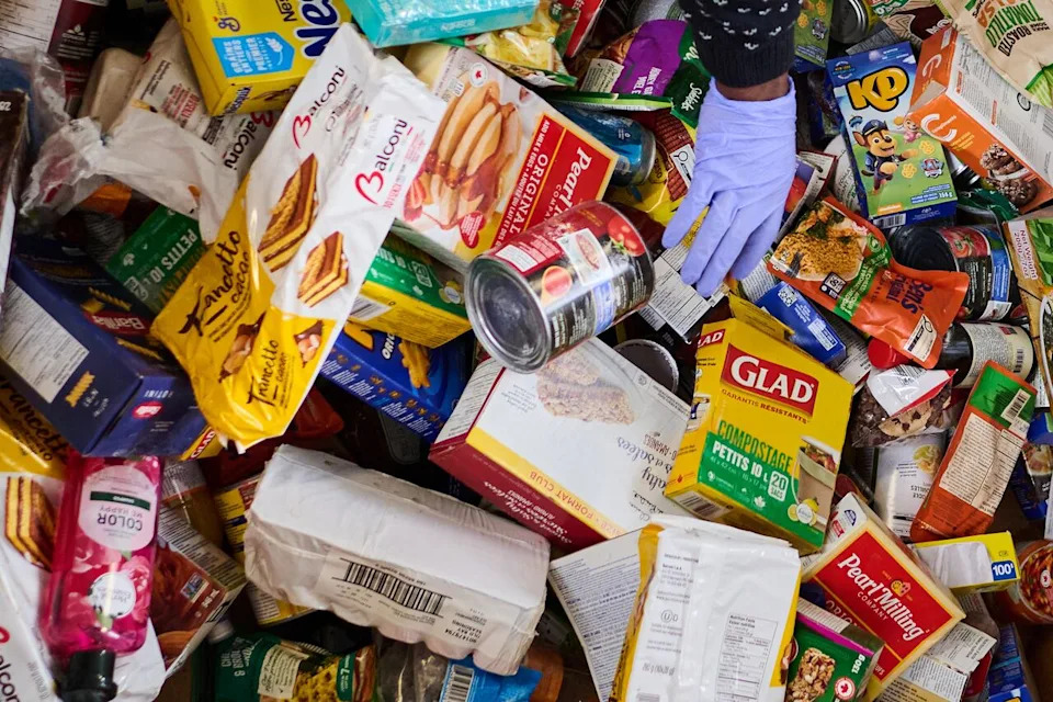 Volunteers sort and pack food donations at the Daily Bread Food Bank’s spring public food sort in Toronto, on Saturday, April 4, 2026. THE CANADIAN PRESS/Sammy Kogan