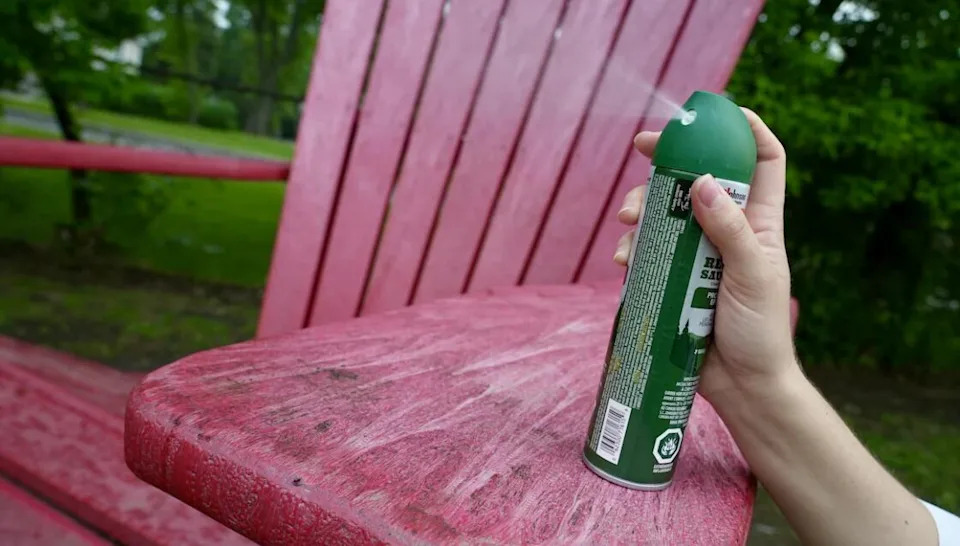 A person sprays mosquito repellent in this undated photo.