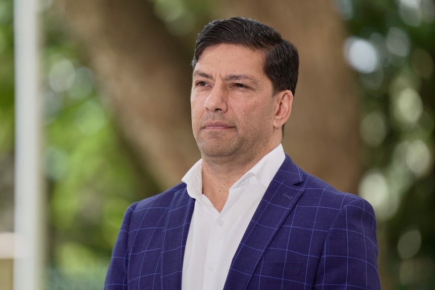 A politician wearing a striped suit.