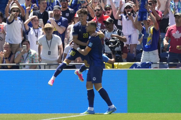 epa13061742 Edin Dzeko of Bosnia and Herzegovina (R) and his teammates celebrate the 2-0 goal during the FIFA World Cup 2026 group stage match Bosnia and Herzegovina against Qatar, in Seattle, Washington, USA, 24 June 2026. EPA/STEPHAN BRASHEAR