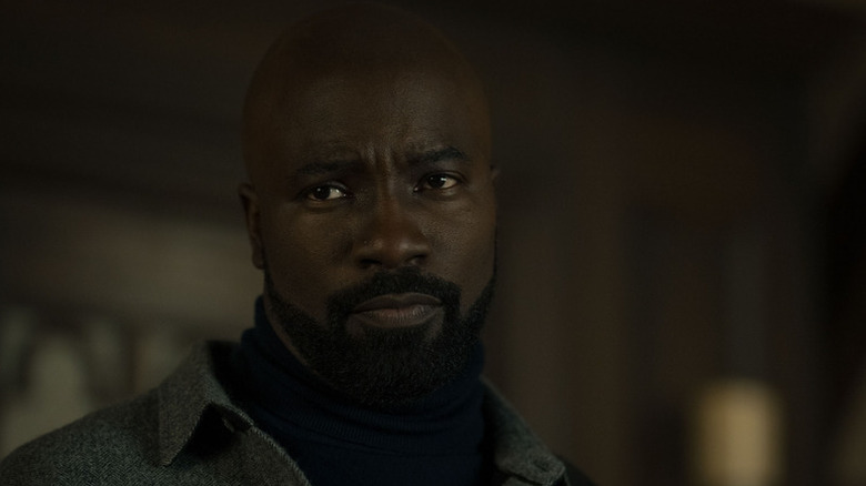 David Acosta (Mike Colter) looks ahead skeptically in Evil