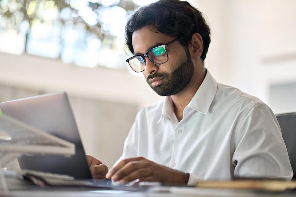 Analyst working on a laptop.