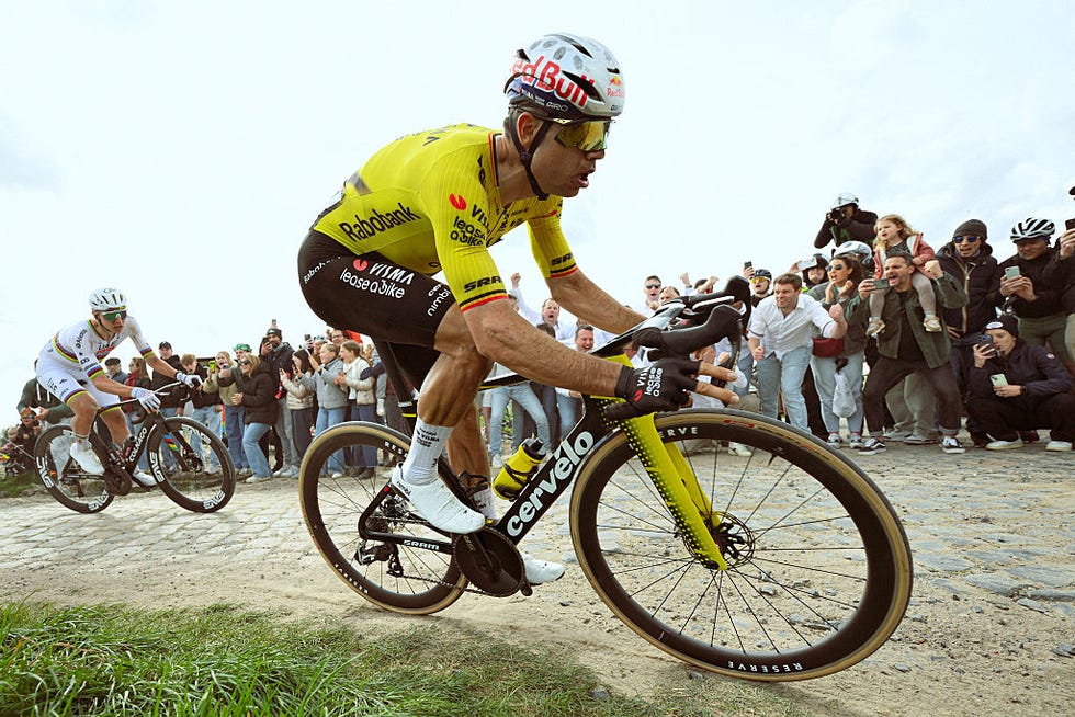 roubaix, france april 12 r  l wout van aert of belgium and team visma  lease a bike and tadej pogacar of slovenia and uae team emirates  xrg compete in the breakaway passing through the carrefour de larbre cobblestones sector while fans cheer during the 123rd parisroubaix hautsdefrance 2026  mens elite a 2583km one day race from compiegne to roubaix  uciwt  on april 12, 2026 in roubaix, france photo by dario belingherigetty images