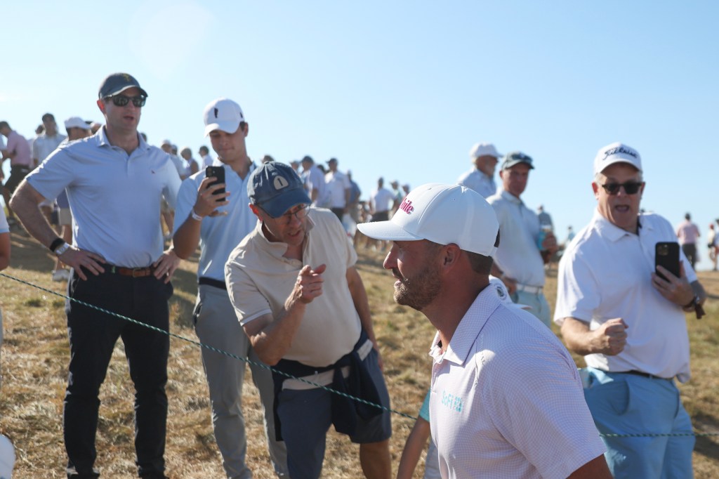 Wyndham Clark speaks with fans while walking between holes at the 126th U.S. Open Championship.