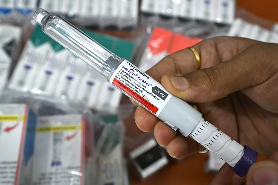 A medicine distributor displays Mounjaro (tirzepatide) self-injecting GLP-1 prefilled pens at his office in Thane, India (AFP via Getty Images)