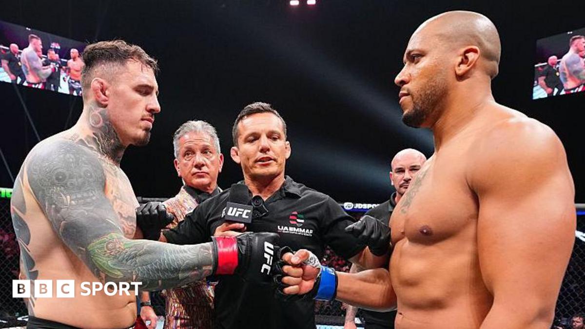 Tom Aspinall and Ciryl Gane touch gloves before their UFC fight in October 2025