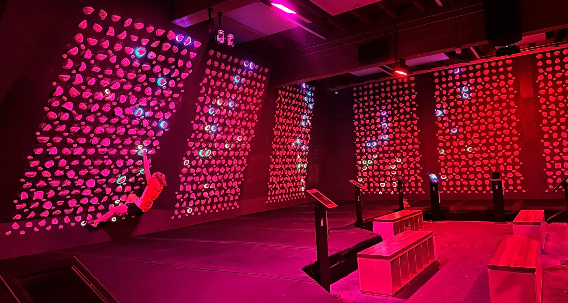 roq hiit climbing classes: a climber worked a kilter board
