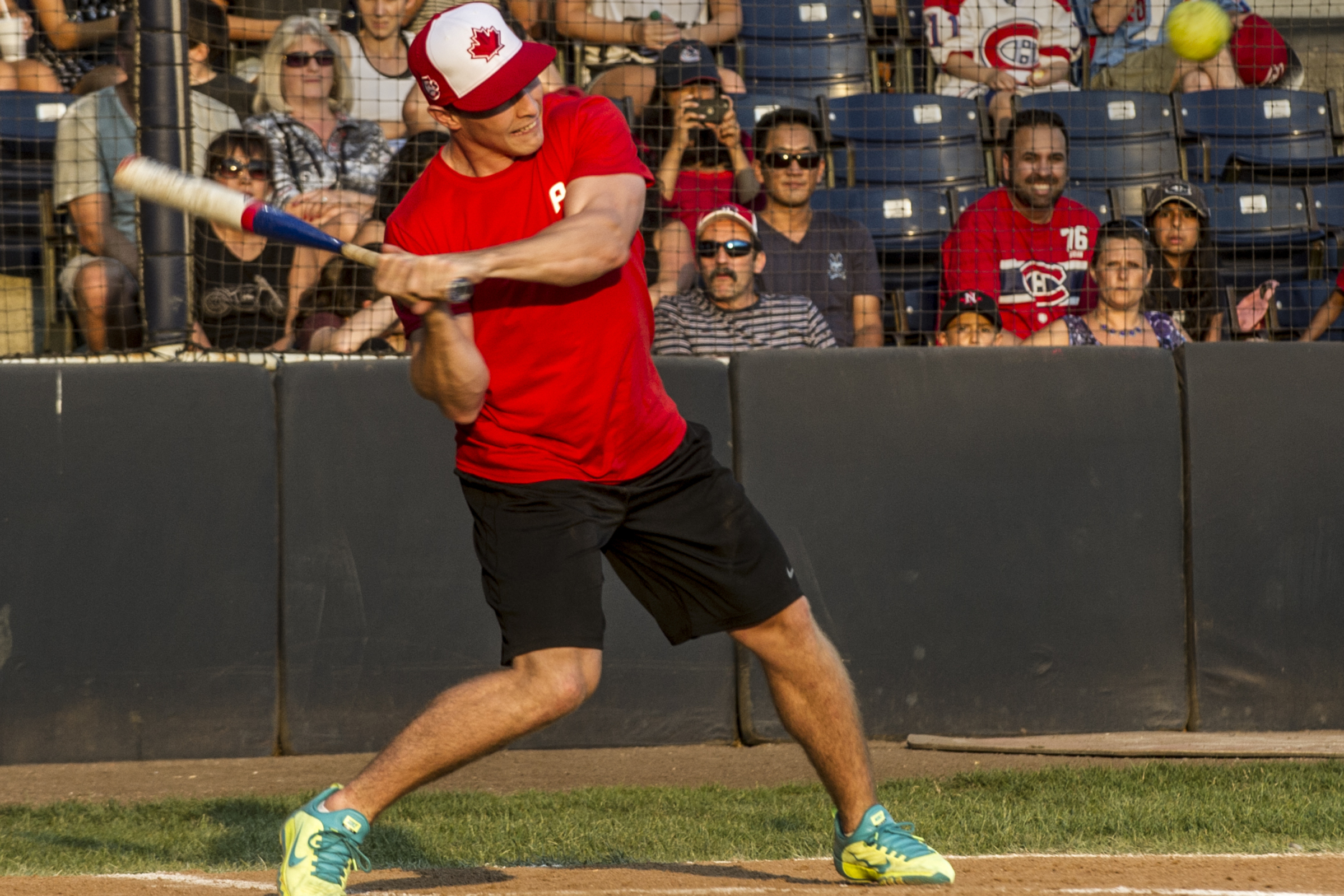 Brendan Gallagher swings a baseball bat during a baseball game.