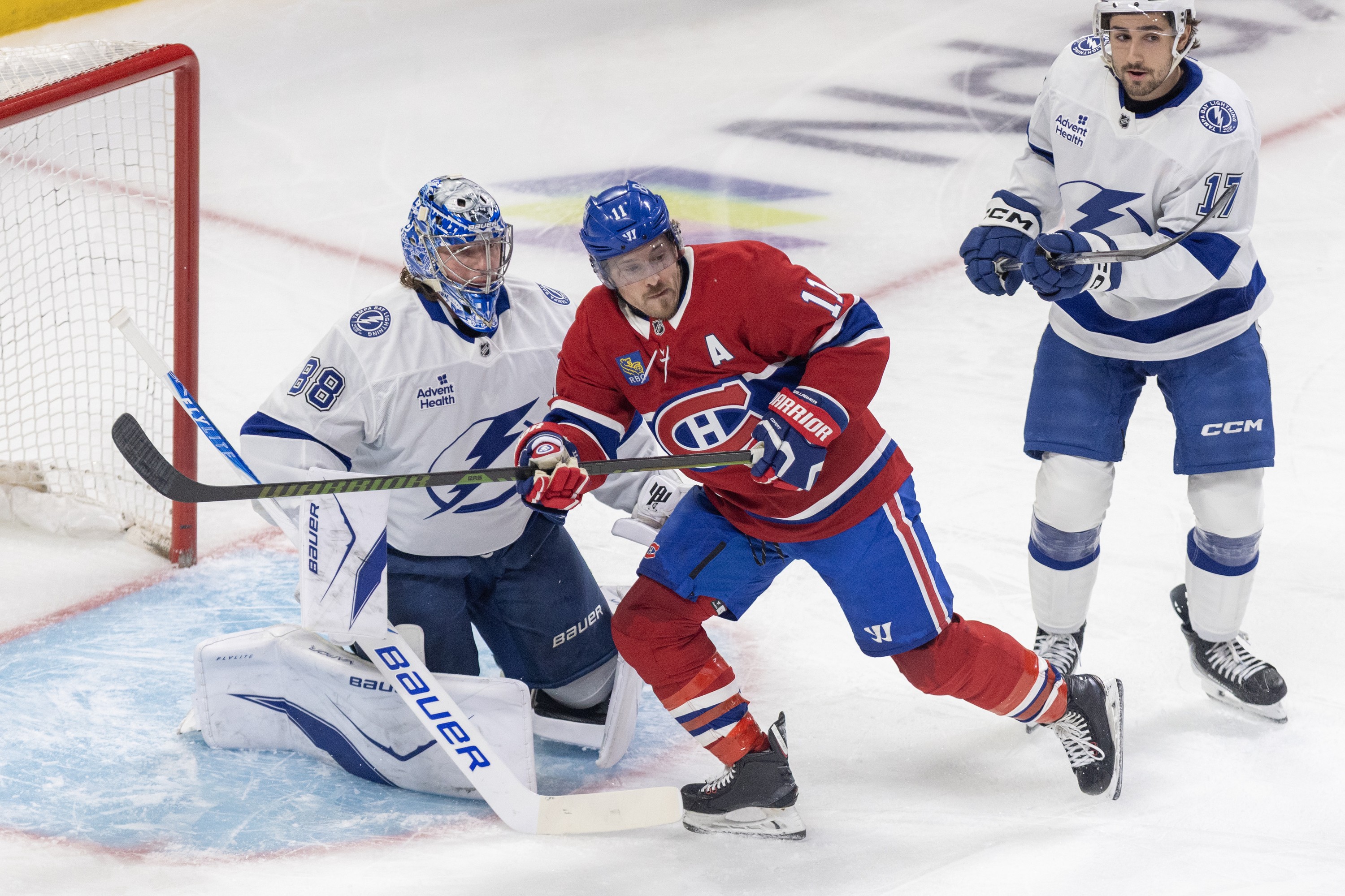 Canadiens winger Brendan Gallagher cuts in front of Tampa Bay Lightning goalie Andrei Vasilevskiy as Dominic James trails during first period of Game 6 in Montreal on May 1.