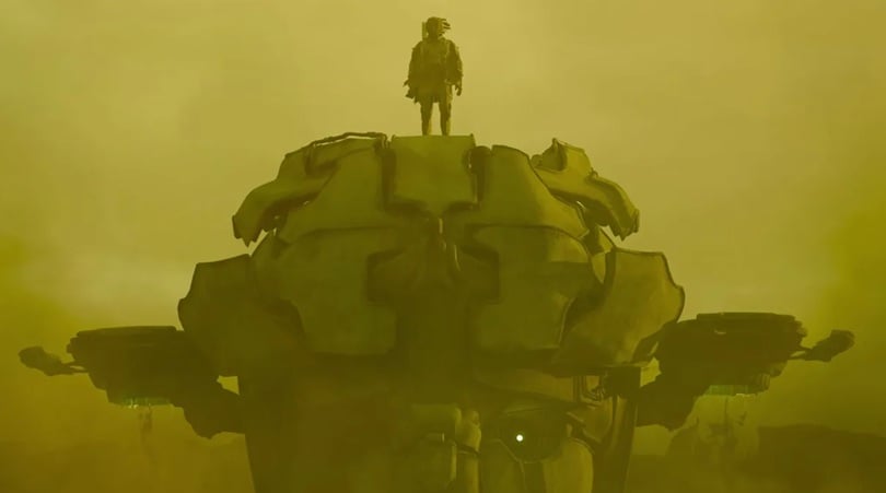 A figure stands on a robot in a sandstorm.