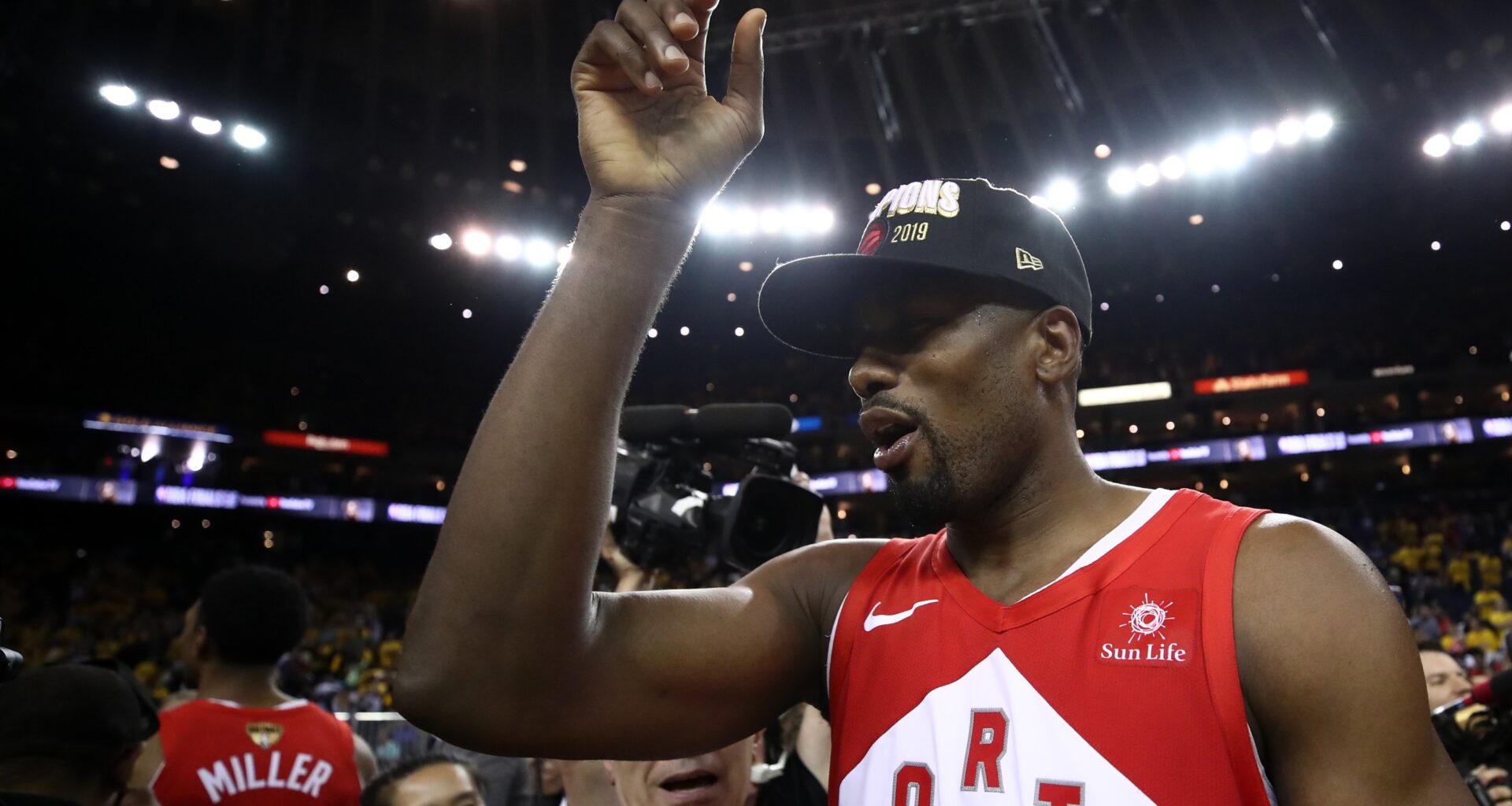 Serge Ibaka is seen on the court wearing an championship hat, after Raptors won the title in 2019.