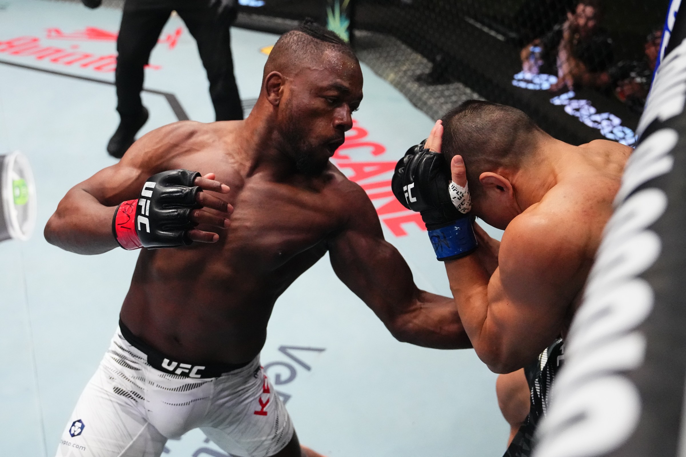LAS VEGAS, NEVADA - MARCH 01: (L-R) Manel Kape of Angola punches Asu Almabayev of Kazakstan in a flyweight fight during the UFC Fight Night event at UFC APEX on March 01, 2025 in Las Vegas, Nevada. (Photo by Jeff Bottari/Zuffa LLC)