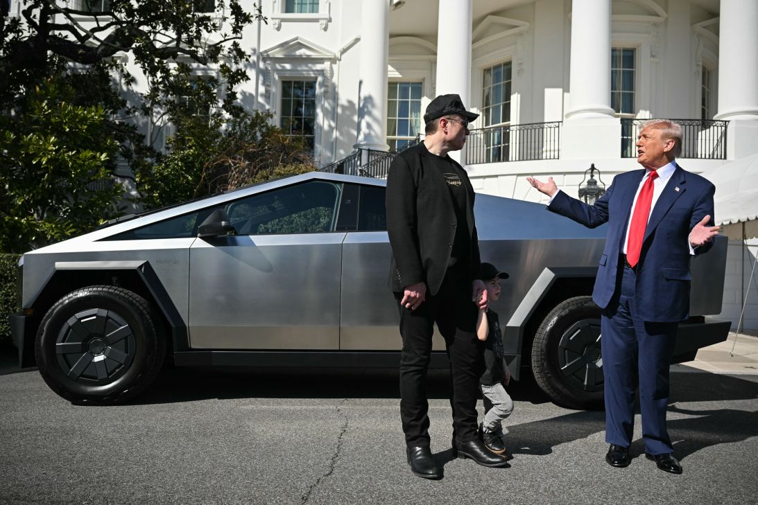 President Donald Trump and Tesla CEO Elon Musk speak to the press as they stand next to a Tesla Cybertruck on the South Portico of the White House on March 11, 2025, in Washington, DC.