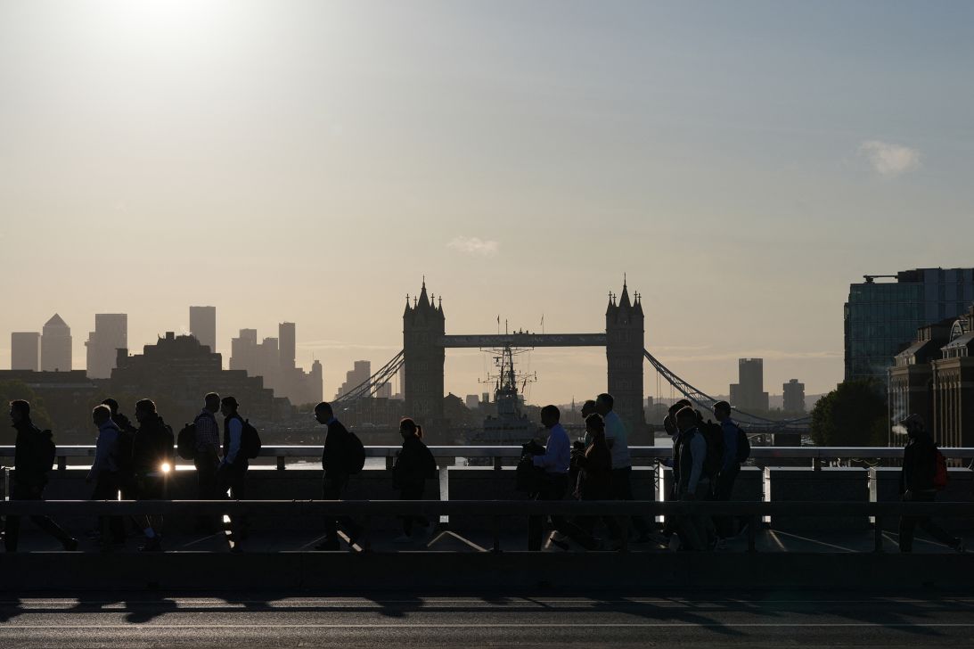 Commuters cross London Bridge early in the morning of September 8, 2025.