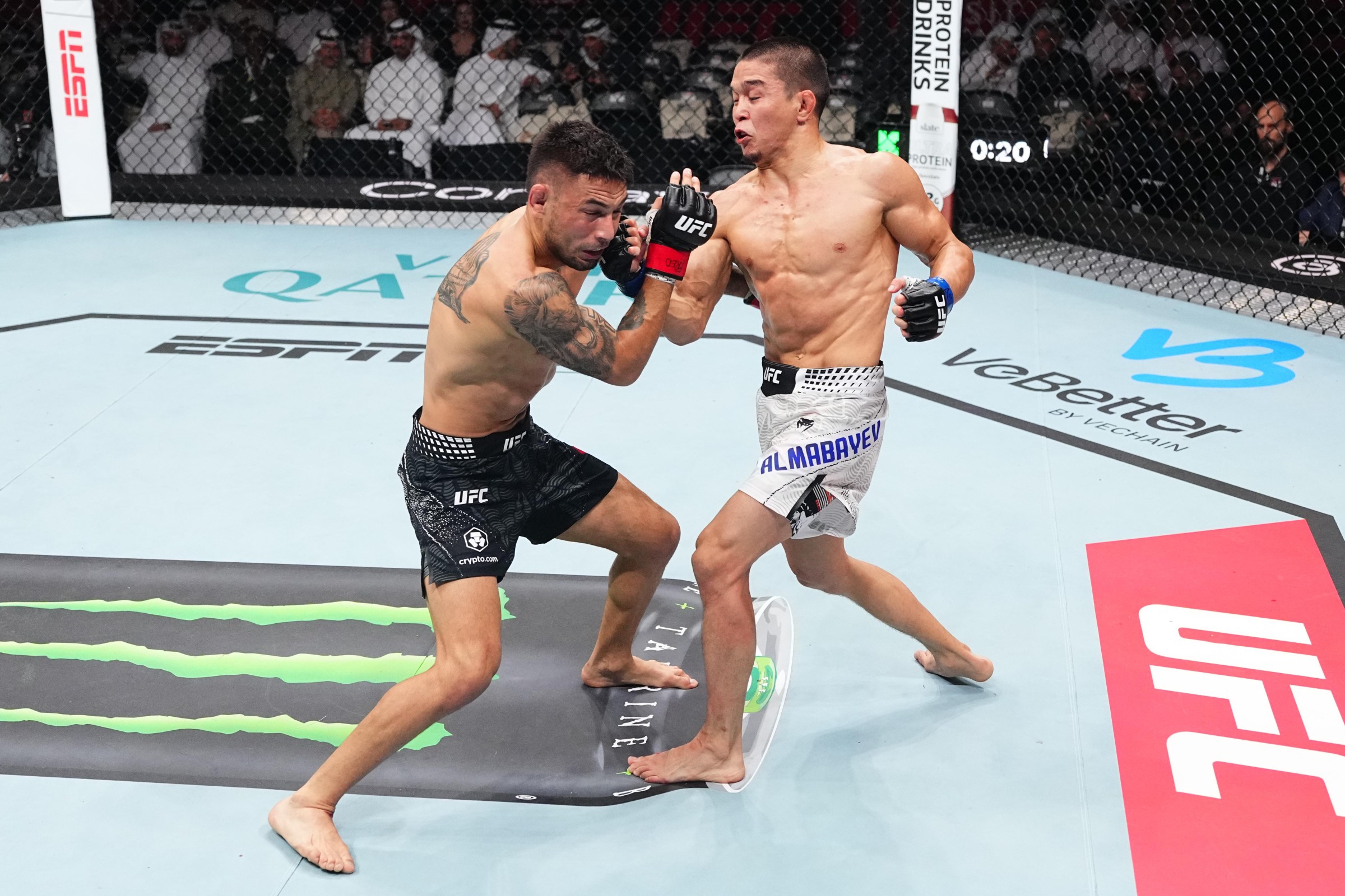 DOHA, QATAR - NOVEMBER 22: (R-L) Asu Almabayev of Kazakstan punches Alex Perez in a flyweight fight during the UFC Fight Night event at ABHA Arena on November 22, 2025 in Doha, Qatar. (Photo by Jeff Bottari/Zuffa LLC)