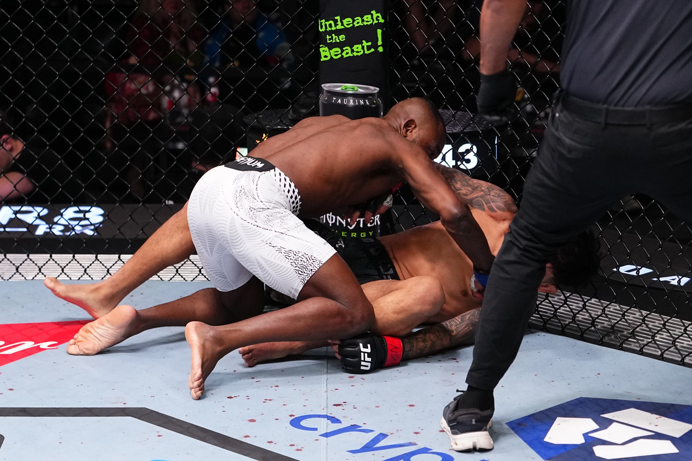 LAS VEGAS, NEVADA - DECEMBER 13: (L-R) Manel Kape of Angola punches Brandon Royval in a flyweight fight during the UFC Fight Night event at UFC APEX on December 13, 2025 in Las Vegas, Nevada. (Photo by Jeff Bottari/Zuffa LLC)