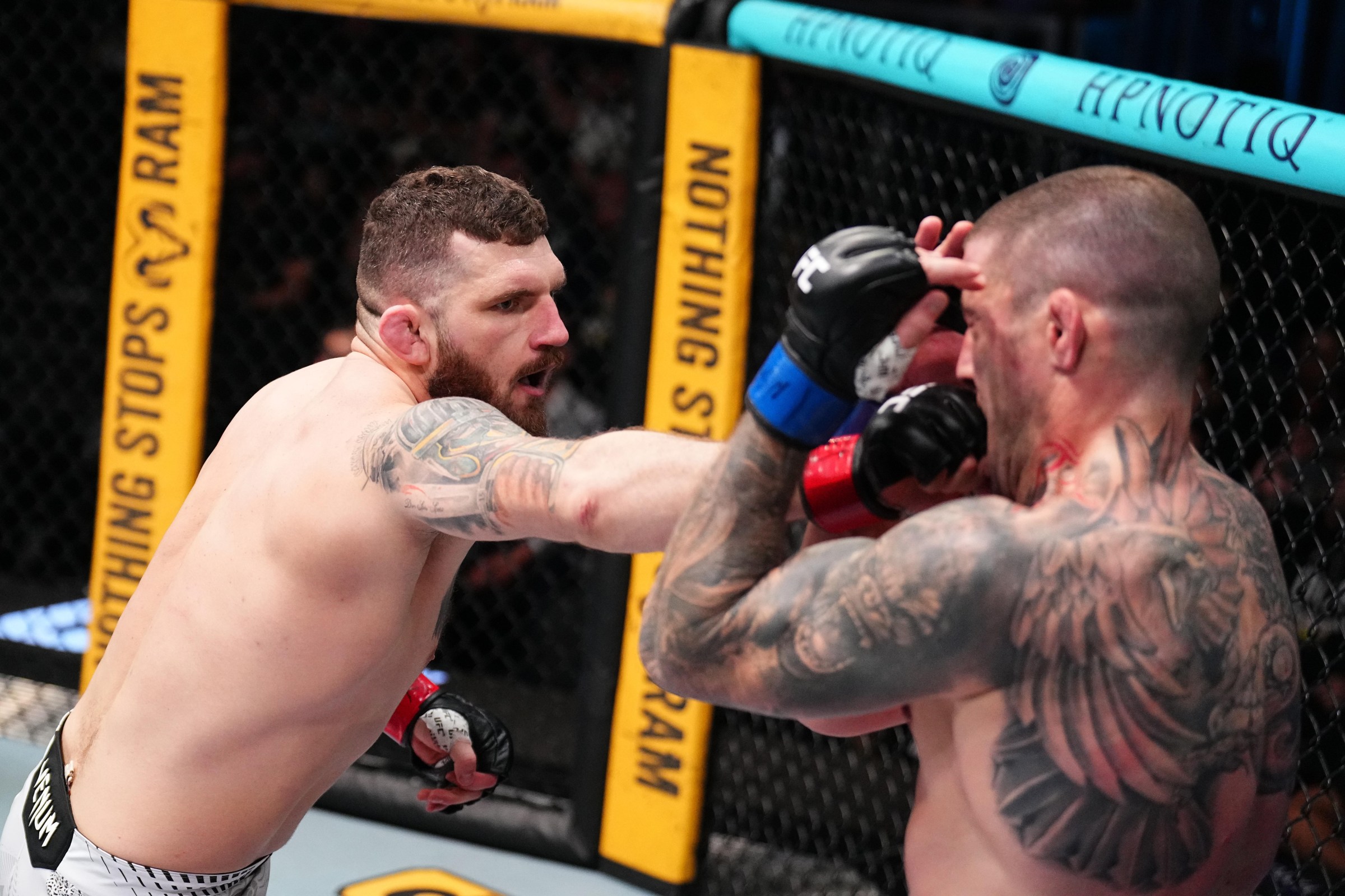 LAS VEGAS, NEVADA - FEBRUARY 07: (L-R) Michal Oleksiejczuk of Poland punches Marc-Andre Barriault of Canada in a middleweight fight during the UFC Fight Night event at Meta APEX on February 07, 2026 in Las Vegas, Nevada. (Photo by Chris Unger/Zuffa LLC)
