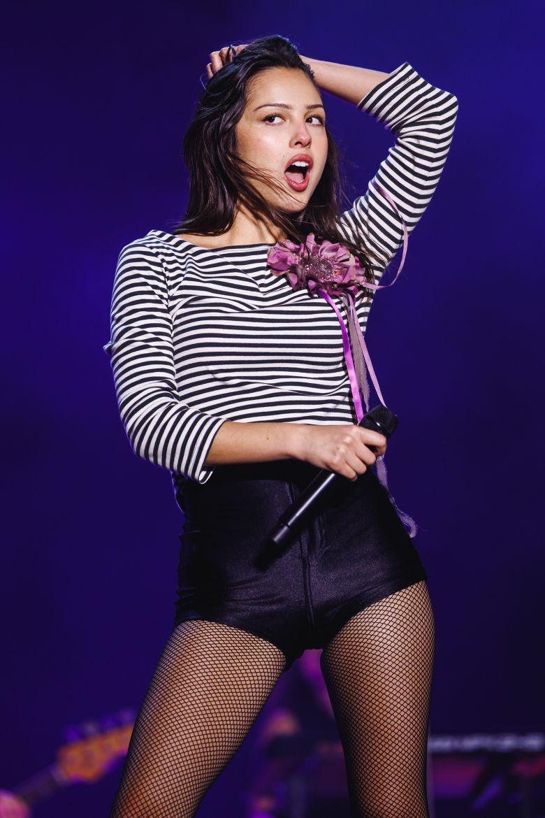 Olivia Rodrigo at the 2026 Primavera Sound Festival in Barcelona, sporting a striped boatneck shirt and American Apparrel-esque disco shorts.