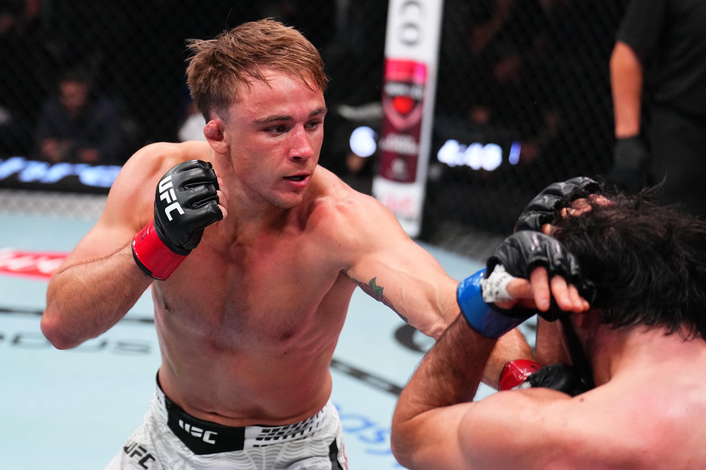 LAS VEGAS, NEVADA - JUNE 20: (L-R) Shane Collins punches Otari Tanzilovi of Georgia in a featherweight fight during the UFC Fight Night event at Meta APEX on June 20, 2026 in Las Vegas, Nevada. (Photo by Chris Unger/Zuffa LLC)
