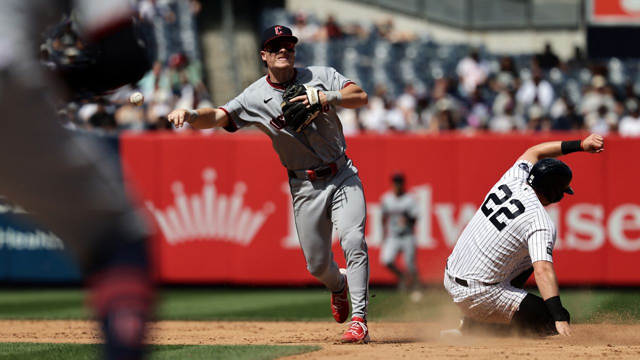 Cleveland Guardians second baseman Travis Bazzana throws to first after getting a force out on New York Yankees' Benb Rice to complete the double play on Paul Goldschmidt at first base during the sixth inning of a baseball game Thursday, June 4, 2026, in New York. (AP Photo/Adam Hunger)