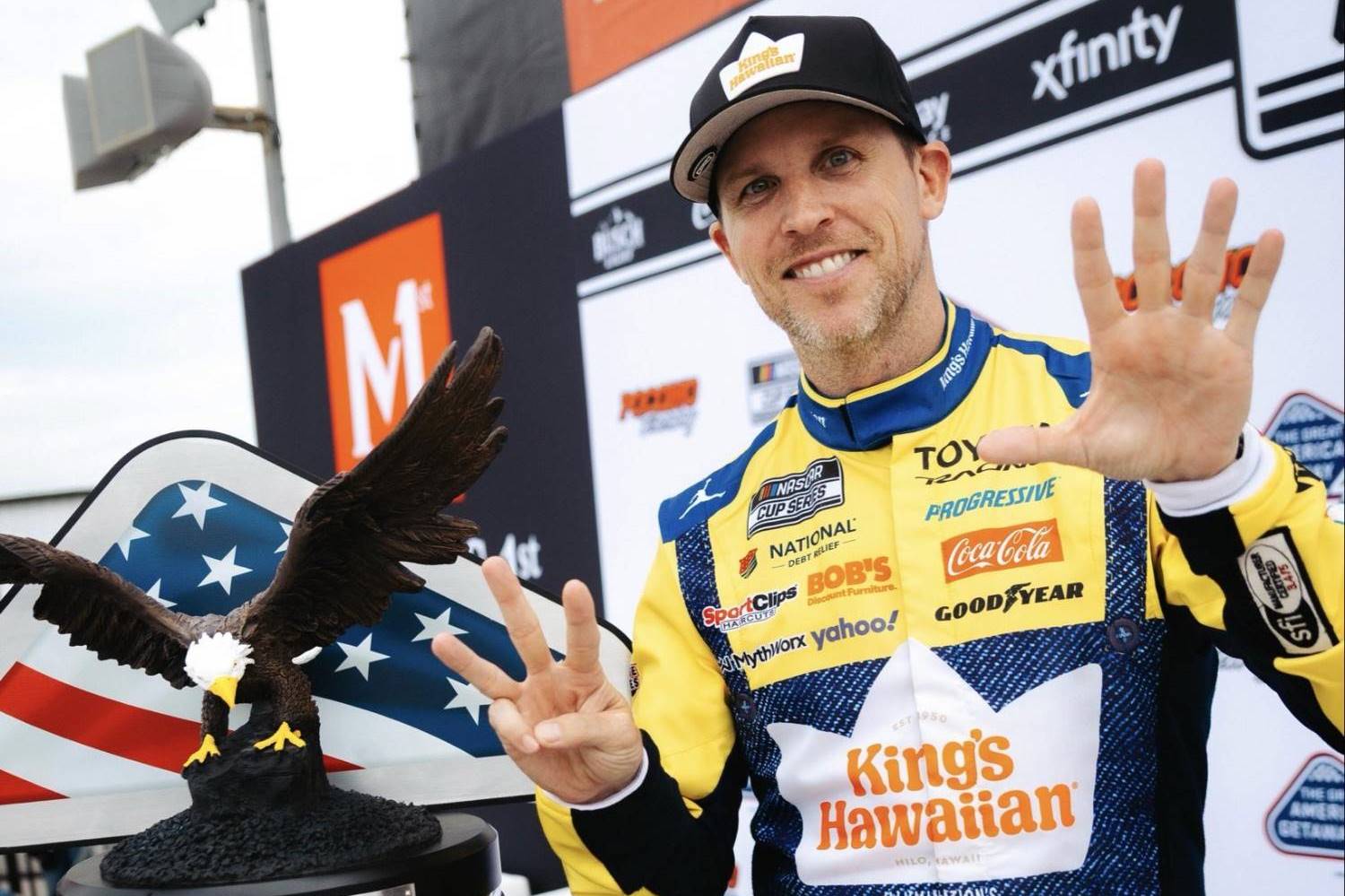 Joe Gibbs Racing driver Denny Hamlin hoisted his record eighth NASCAR Cup Series trophy at the iconic 2.5-mile Pocono track in Sundays The Great American Getaway 400 presented by VISITPA  his No. 11 JGR Toyota